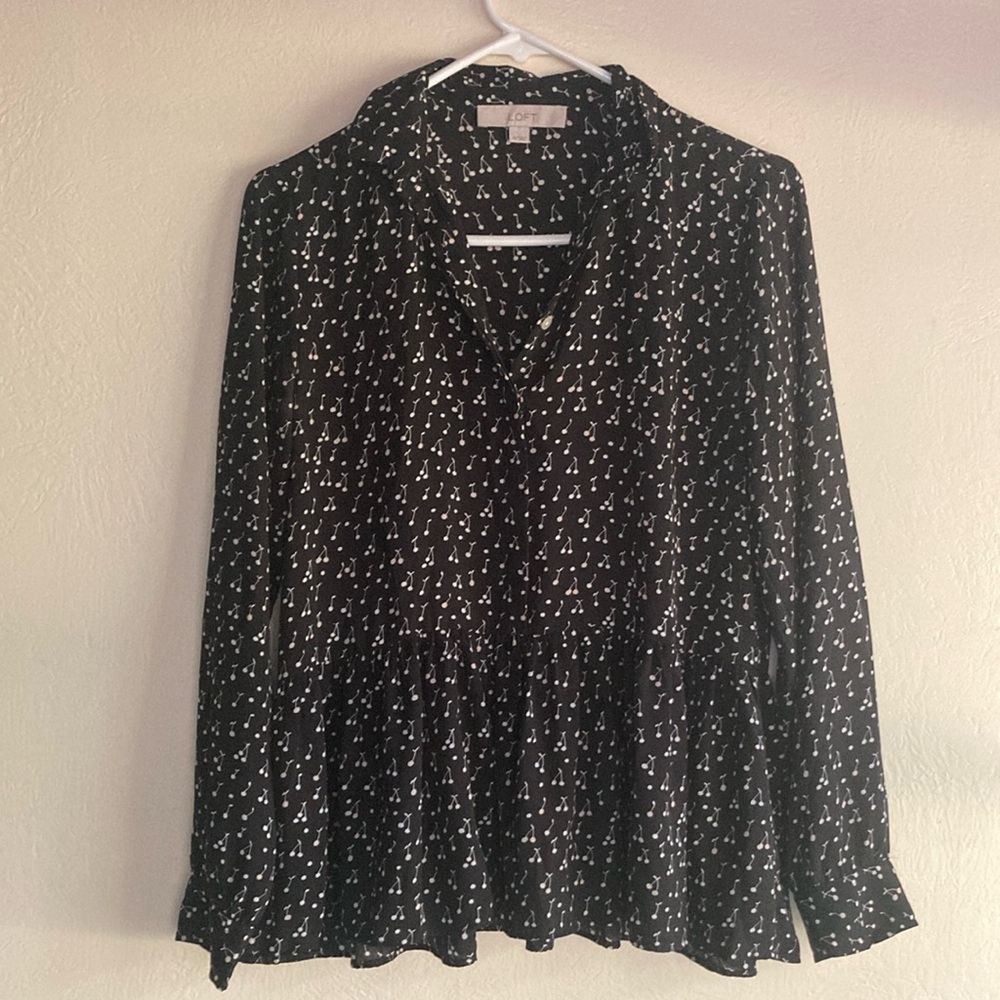 Black blouse with white cherries pattern.